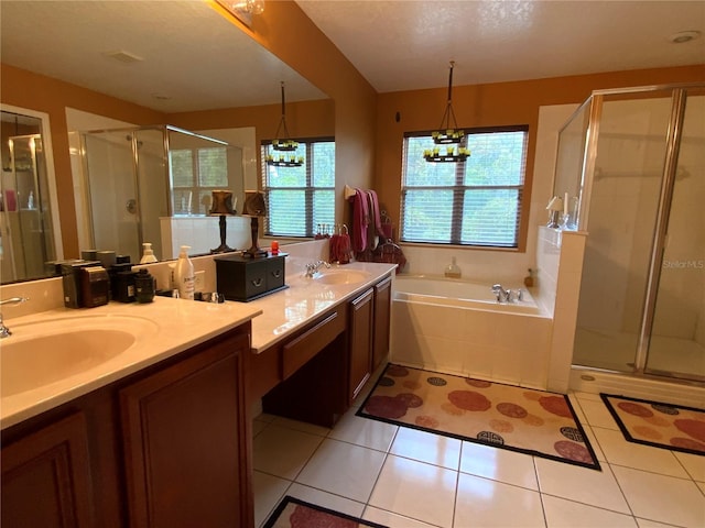 bathroom featuring shower with separate bathtub, tile patterned flooring, a textured ceiling, an inviting chandelier, and vanity