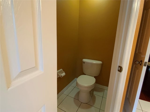 bathroom featuring tile patterned flooring and toilet