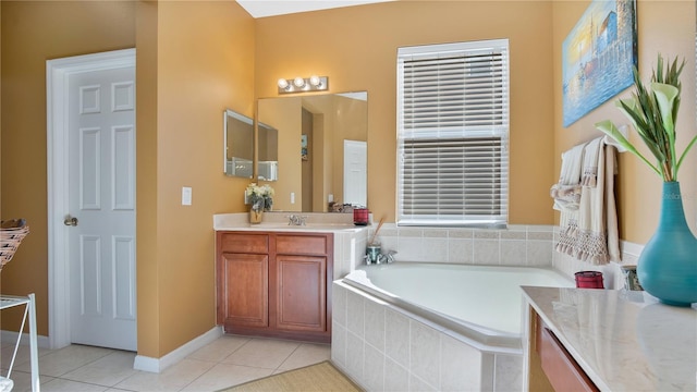 bathroom featuring vanity, a relaxing tiled tub, and tile patterned floors