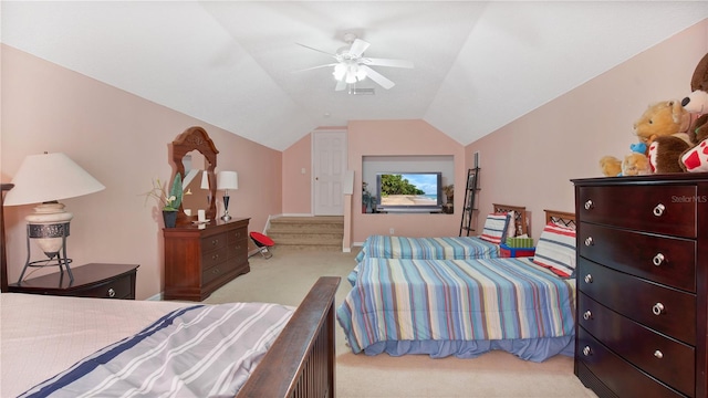 carpeted bedroom with vaulted ceiling and ceiling fan