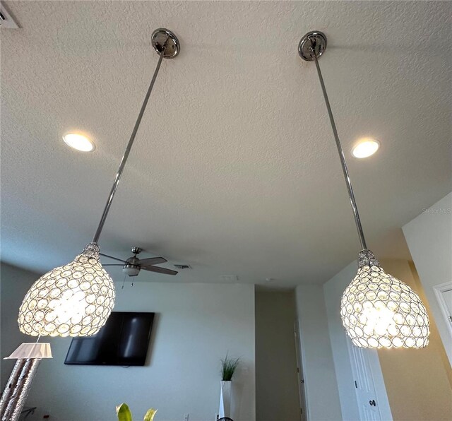 interior details featuring a textured ceiling