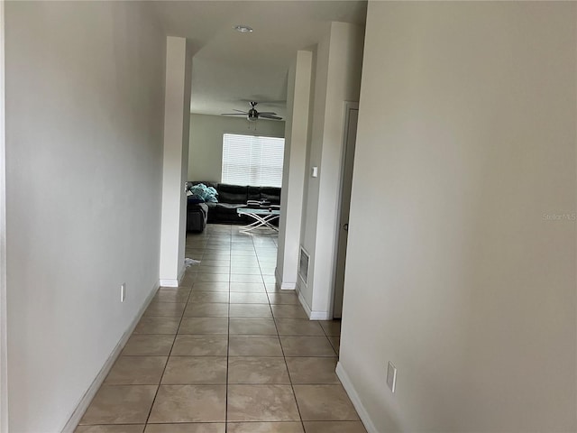 hallway with light tile patterned floors