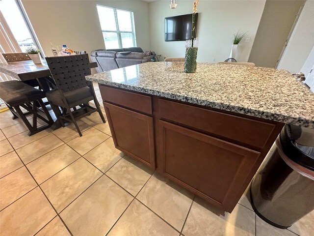 kitchen featuring light stone countertops and light tile patterned floors