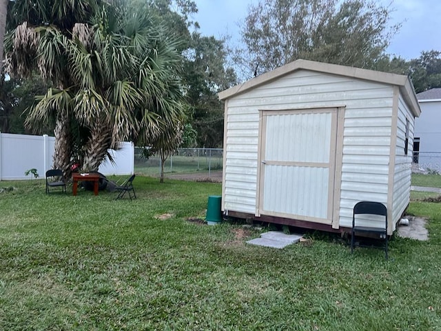 view of outdoor structure featuring a yard