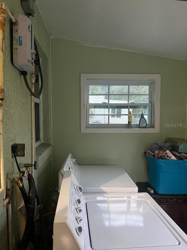 laundry room featuring separate washer and dryer and water heater