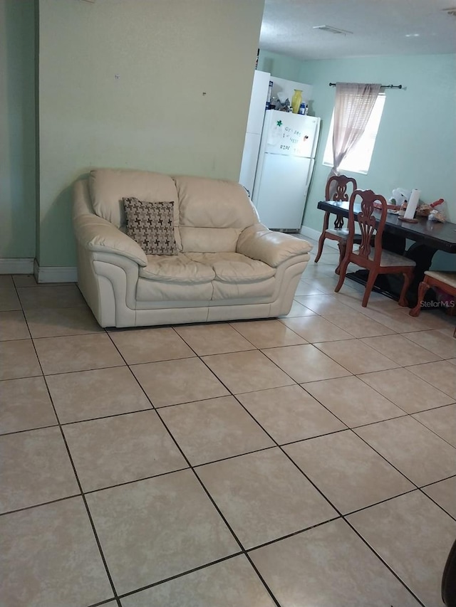 living room featuring light tile patterned floors