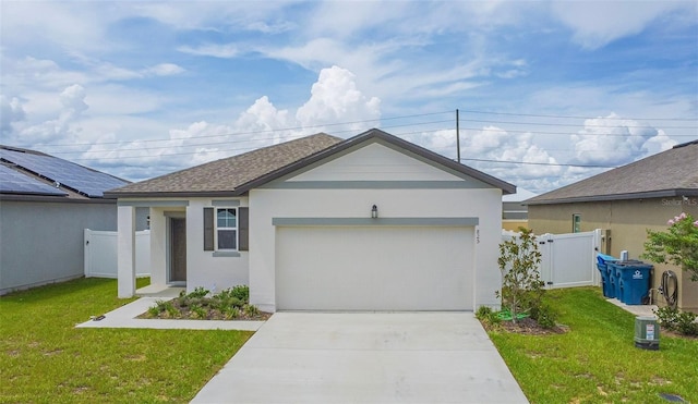 view of front facade featuring a front yard and a garage