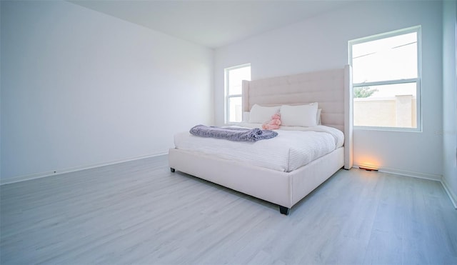 bedroom with light wood-type flooring