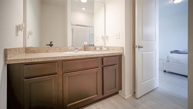 bathroom featuring hardwood / wood-style floors and vanity