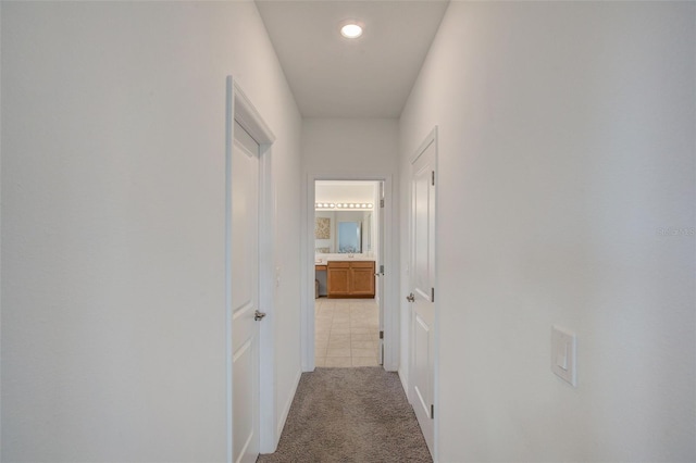 hallway with carpet floors