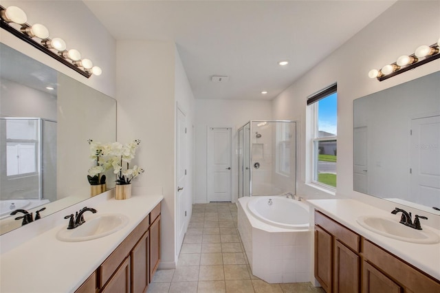 bathroom featuring vanity, tile patterned floors, and shower with separate bathtub