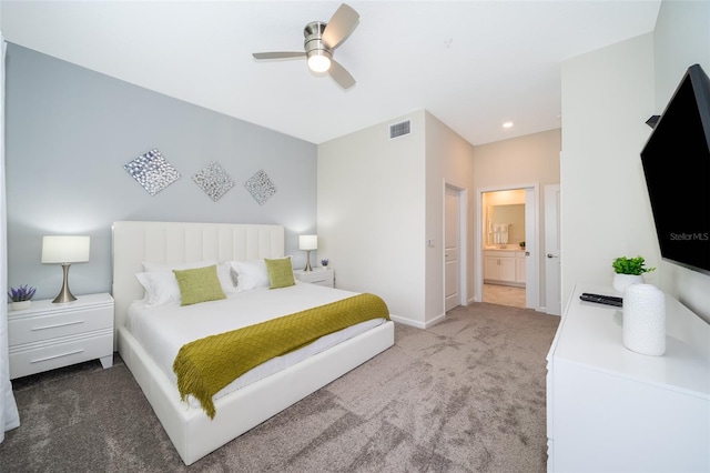 bedroom featuring carpet floors, ensuite bath, and ceiling fan