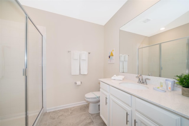 bathroom with a shower with shower door, vanity, tile patterned flooring, and toilet