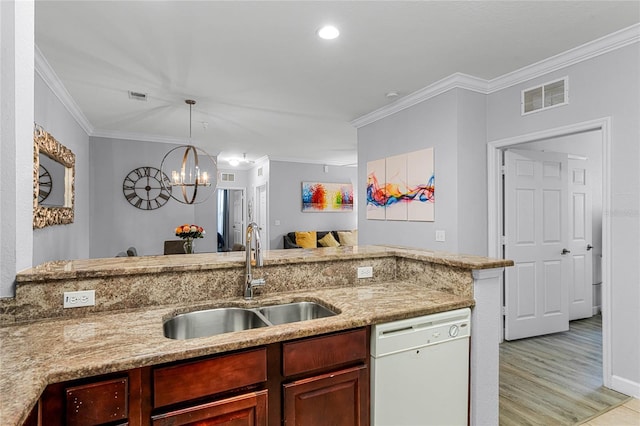 kitchen featuring white dishwasher, sink, light hardwood / wood-style flooring, ornamental molding, and a notable chandelier