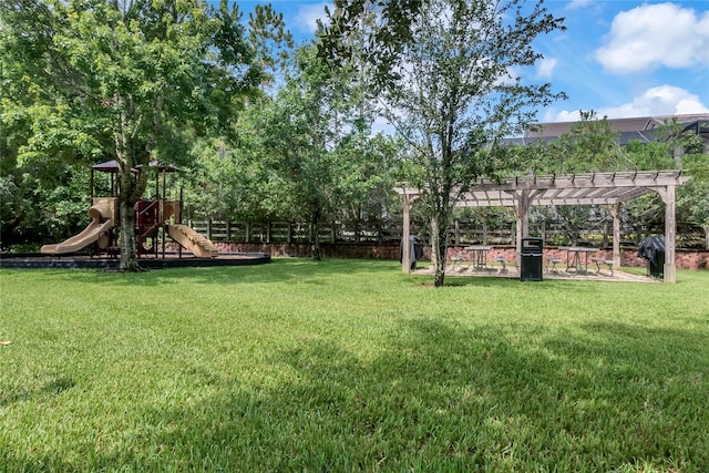 view of yard featuring a playground and a pergola