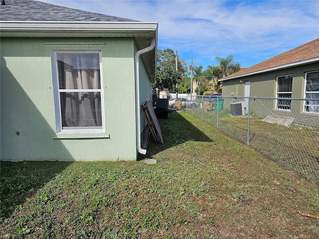 view of property exterior featuring cooling unit and a yard