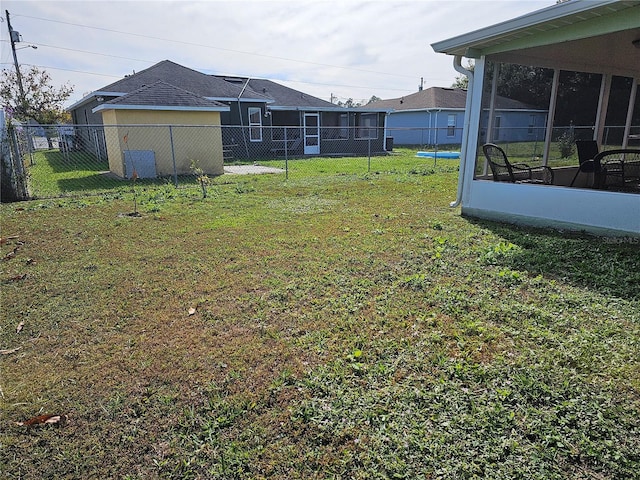 view of yard featuring a sunroom