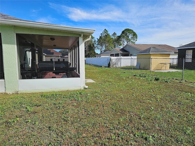 view of yard with a sunroom