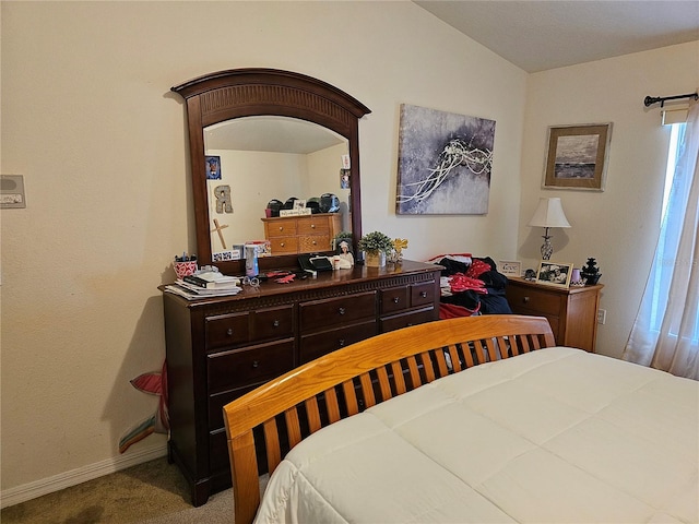 bedroom featuring carpet floors and lofted ceiling