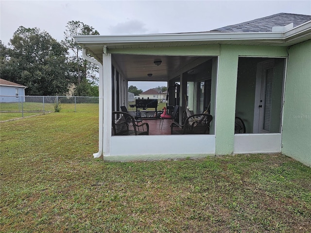 view of yard featuring a sunroom