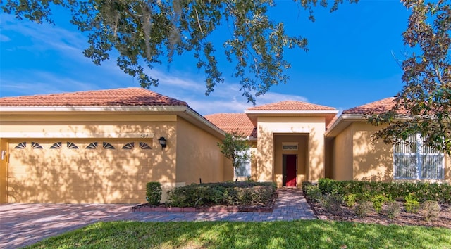 mediterranean / spanish-style home featuring a garage