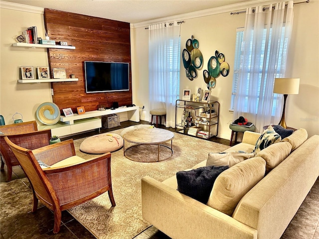 living room with crown molding and wooden walls