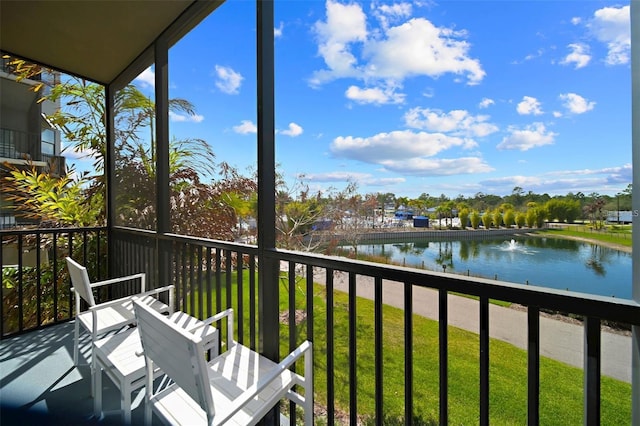 balcony featuring a water view