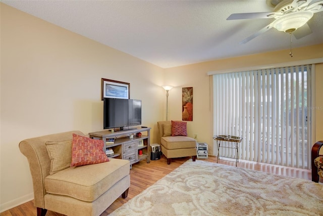 interior space featuring ceiling fan, a textured ceiling, and light wood-type flooring