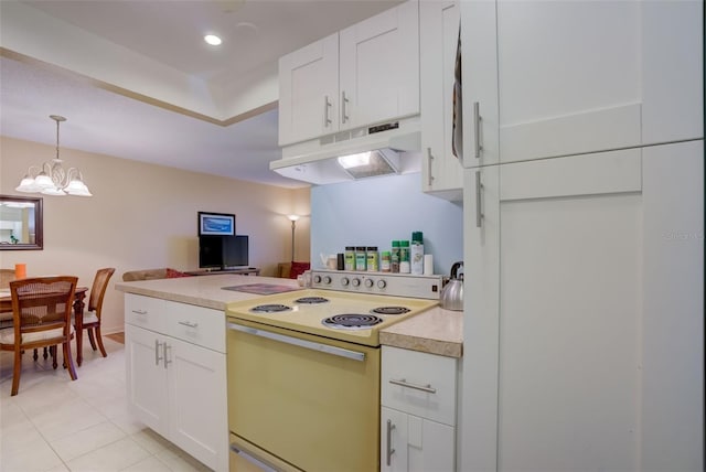 kitchen featuring pendant lighting, white cabinetry, white electric stove, and a chandelier