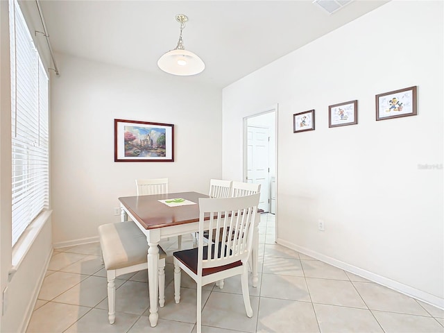 dining space featuring light tile patterned floors