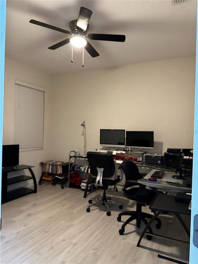 office space featuring light hardwood / wood-style floors and ceiling fan