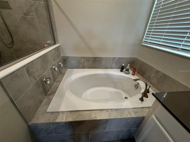 bathroom with tiled tub