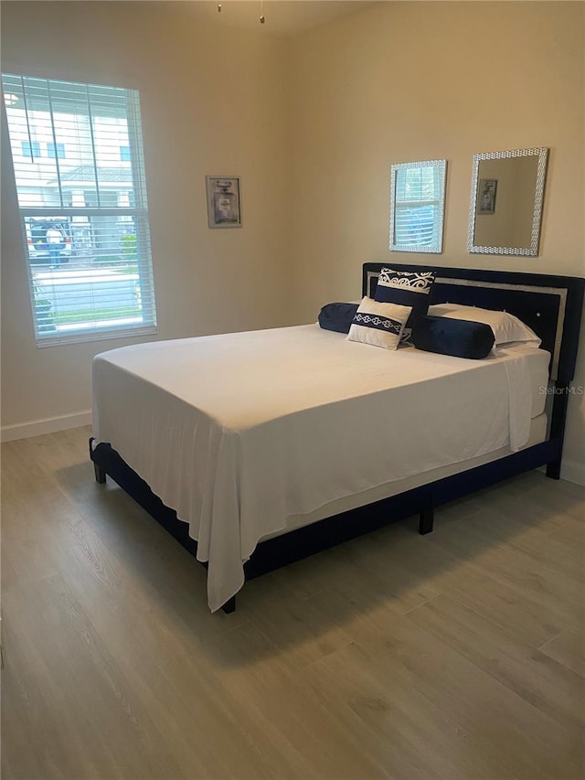 bedroom featuring wood-type flooring