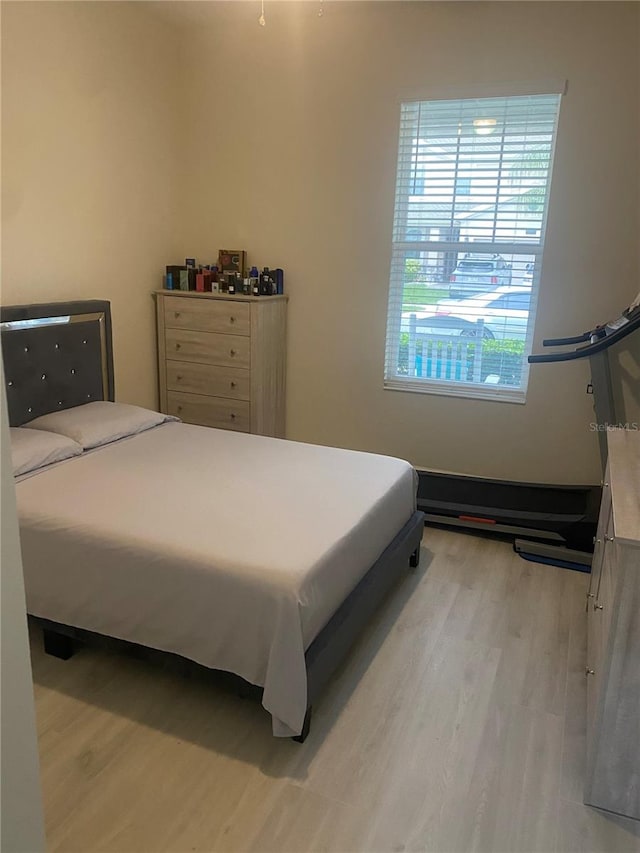 bedroom with light hardwood / wood-style flooring