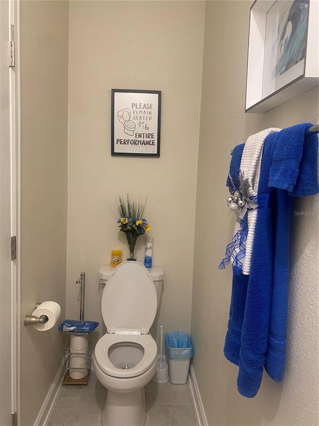 bathroom featuring tile patterned flooring and toilet