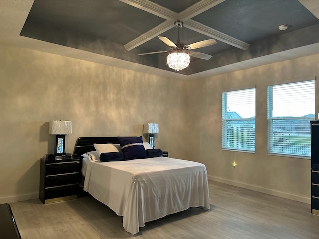 bedroom with light wood finished floors, ceiling fan, baseboards, beamed ceiling, and coffered ceiling