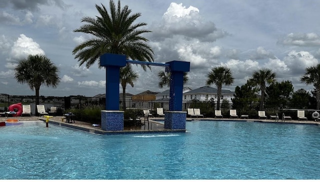 view of pool with pool water feature