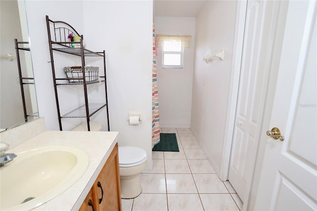 bathroom featuring vanity, a shower with curtain, toilet, and tile patterned floors