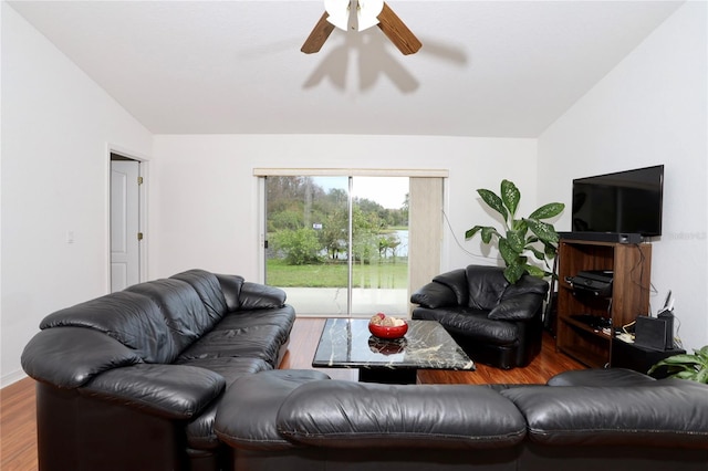 living room with ceiling fan, wood-type flooring, and lofted ceiling