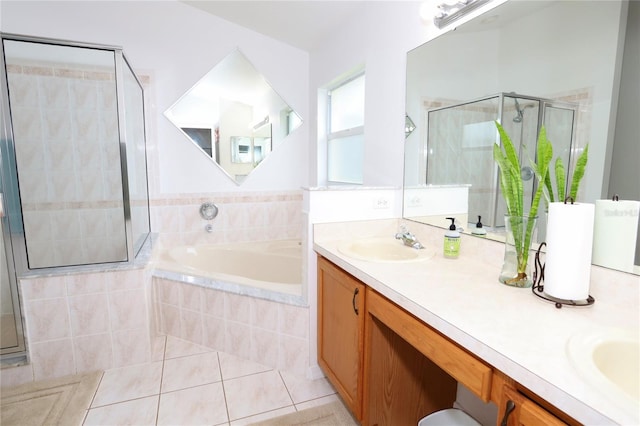 bathroom with vanity, independent shower and bath, and tile patterned flooring