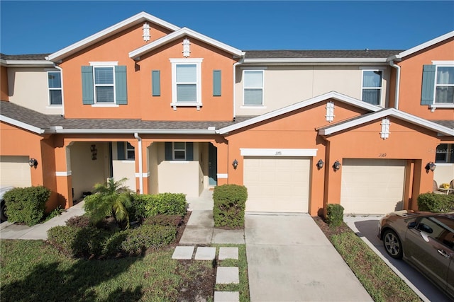 3171 Tocoa Cir, Kissimmee, FL 34746 - multi unit property featuring stucco siding, a garage, and driveway