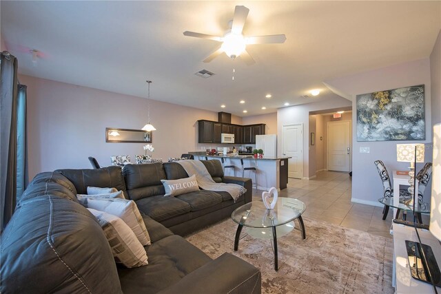 3171 Tocoa Cir, Kissimmee, FL 34746 - living room with light tile patterned floors, a ceiling fan, baseboards, and recessed lighting