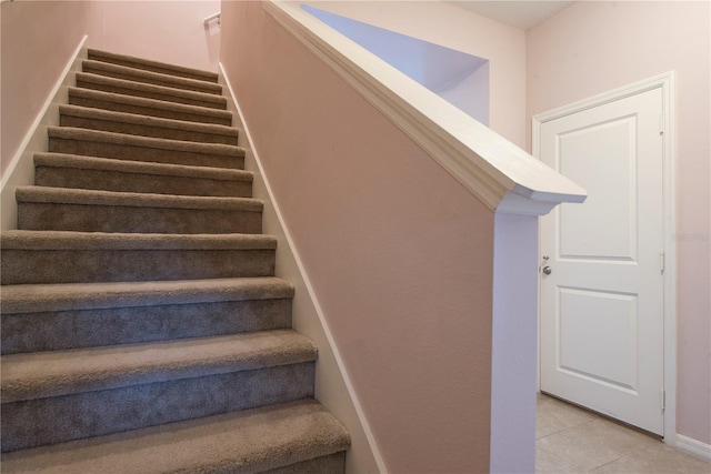3171 Tocoa Cir, Kissimmee, FL 34746 - stairs featuring tile patterned flooring and baseboards