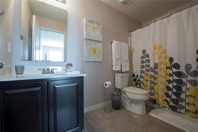 3171 Tocoa Cir, Kissimmee, FL 34746 - bathroom featuring tile patterned flooring, toilet, vanity, baseboards, and a shower with curtain