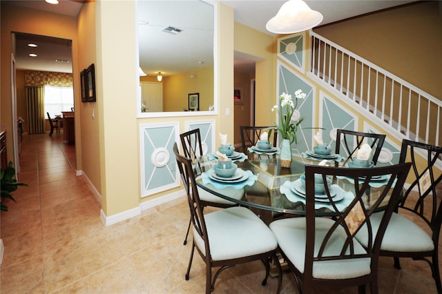 dining area featuring light tile patterned floors