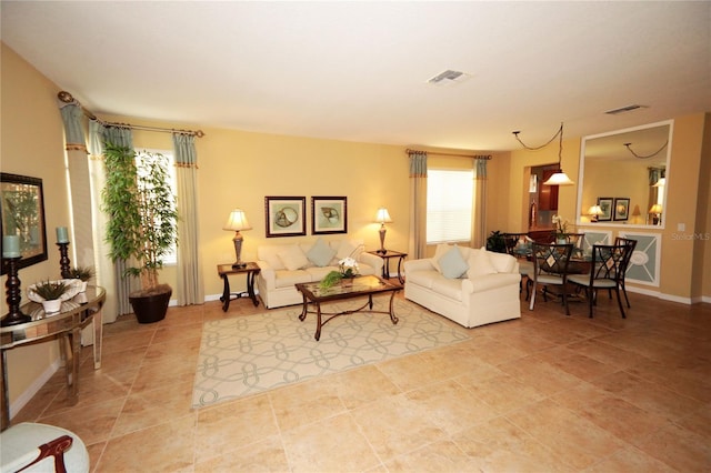 living room with tile patterned floors