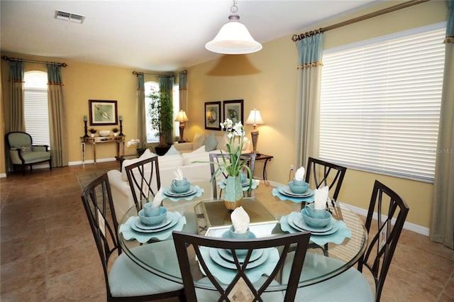 dining space featuring tile patterned floors