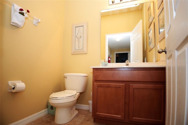 bathroom with tile patterned floors, vanity, and toilet