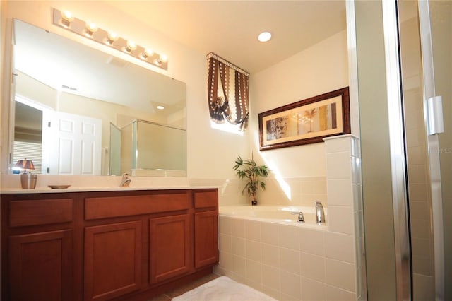 bathroom with vanity and plus walk in shower