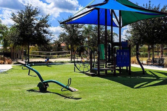 view of play area with a yard and volleyball court